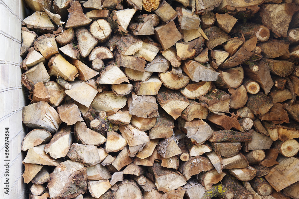 Preparation of firewood for the winter. Stacks of firewood at the home. Pile of firewood. Firewood background. Preparation of firewood for the winter. Stacks of firewood at the home. Pile of firewood. Firewood background.