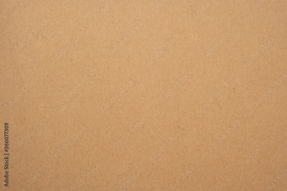 Texture of brown craft or kraft paper background, cardboard sheet, recycle paper, copy space for text.