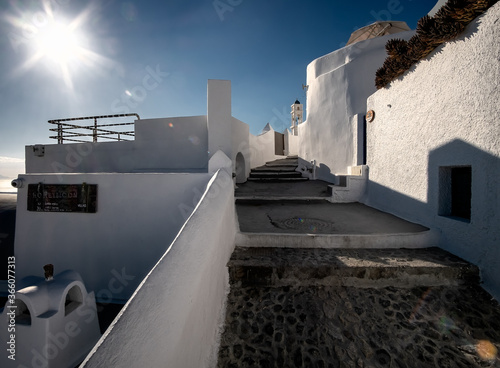 Courtyards of the white city of Santorini under the bright sun. Greece photo