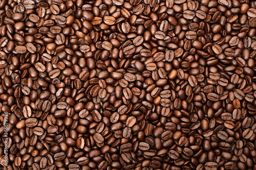 Top view of brown roasted coffee beans, can be use as background, copy space for text.