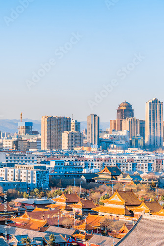 Canvas Print Dazhao Temple in Hohhot, Inner Mongolia, China and the distant view of tall buil