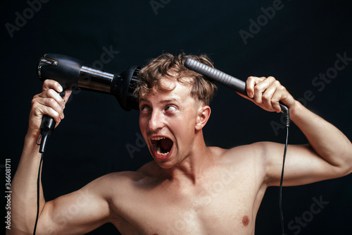 Angry young man loosing hair. Emotion. Male strong. Angry. 