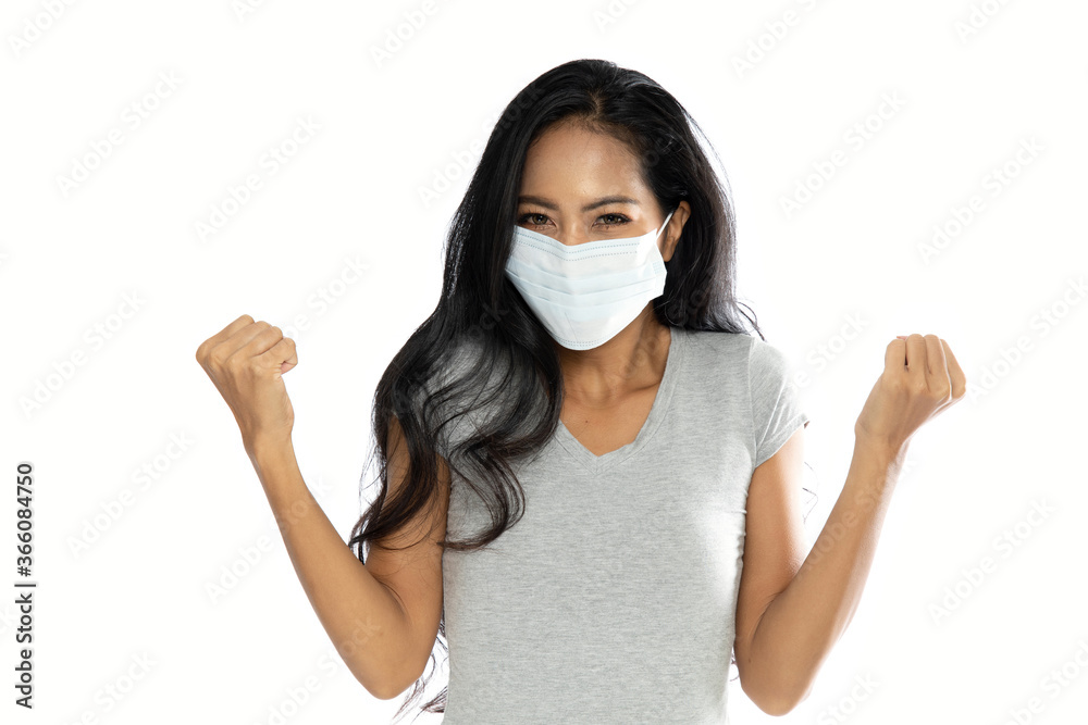 Isolated Happy Asian woman wearing a medical flu mask Isolated Happy Asian woman wearing a medical flu mask
