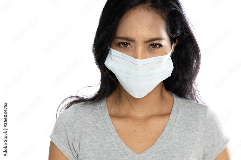 Isolated Asian woman wearing a medical flu mask Isolated Asian woman wearing a medical flu mask