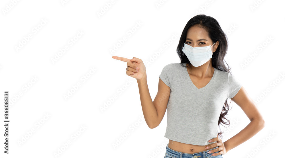 Isolated Happy Asian woman wearing a medical flu mask pointed fingers Isolated Happy Asian woman wearing a medical flu mask pointed fingers