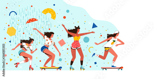 Young cheerful girls ride roller skates and skateboards. Summer rest and entertainment. Fun outdoor activities with friends