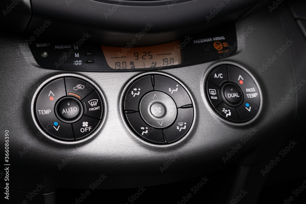 Close up Instrument automobile panel with climat control view with air conditioning buttons- details and controls of modern car... Close up Instrument automobile panel with climat control view with air conditioning buttons- details and controls of modern car...