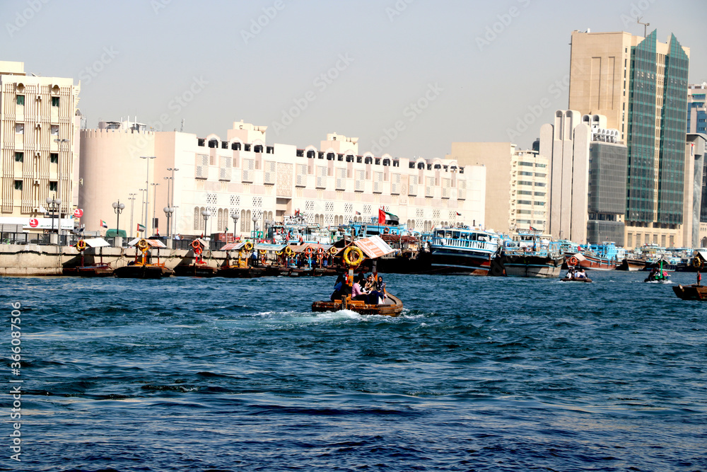  Dubai creek with water taxi(water ride) with background of historical building and modern building