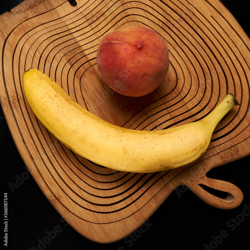 bananas, peaches are on the table