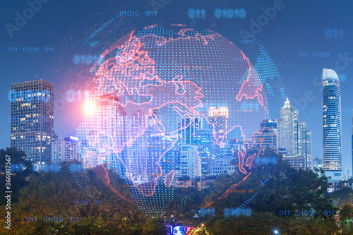 Multi exposure of Bangkok cityscape night time background and world map hologram. Concept of media networking. © VideoFlow