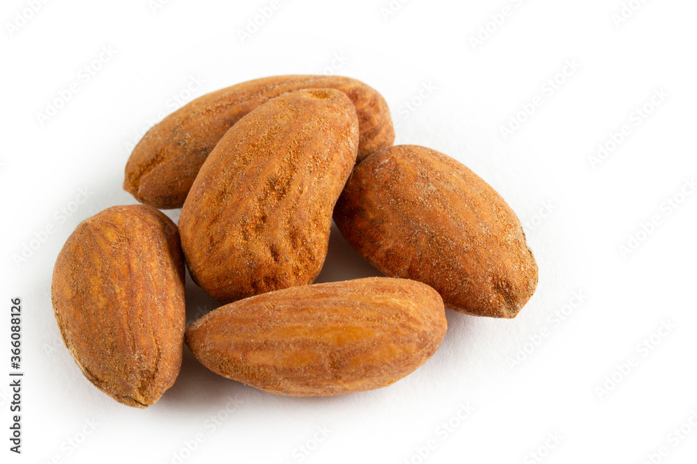 A pile of Almonds, isolated on a white background. A pile of Almonds, isolated on a white background.