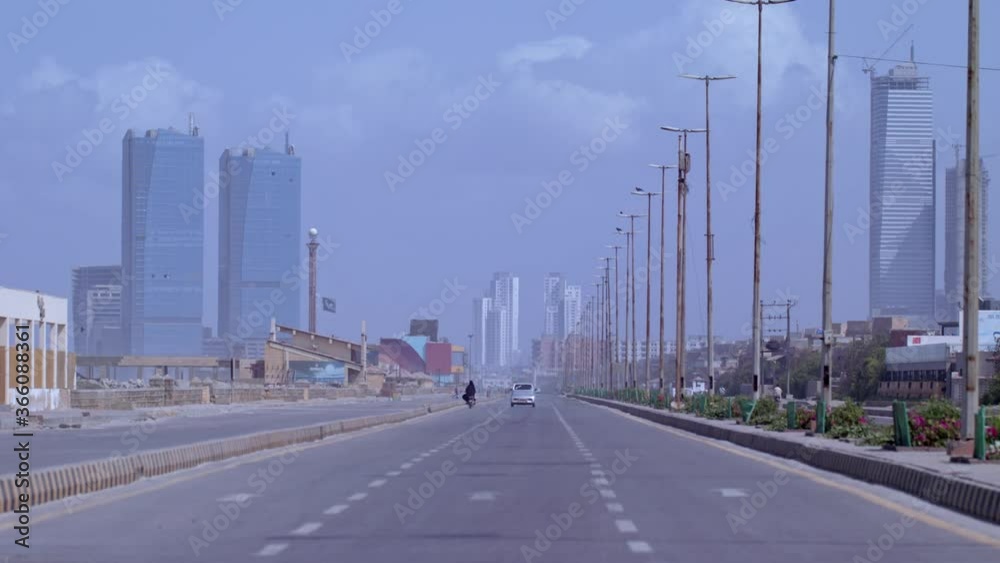 Beach road having less traffic than usual due to lockdown imposed due to coronavirus. Unique shot shows corporate offices and Mall buildings all deserted. Pakistan's National flag (Public Property) Beach road having less traffic than usual due to lockdown imposed due to coronavirus. Unique shot shows corporate offices and Mall buildings all deserted. Pakistan's National flag (Public Property)