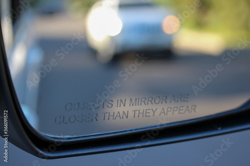 Large vehicle approaching in rear view mirror