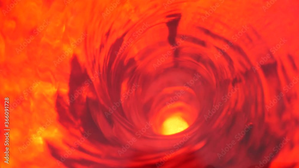 Symbol of hell, inferno and infinity. Red liquid hypnotic aqua swirl turning. Meditative ruby luminous whirlpool. Mesmerising spiral tunnel of crystal fluid. Fiery surreal rhythmic water gradient.