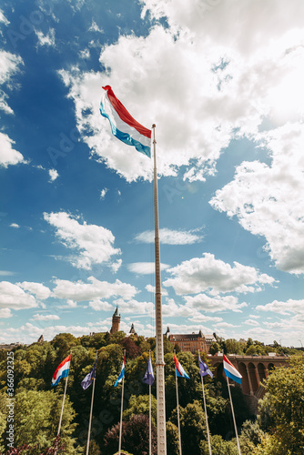 Luxembourg national flag waving over the Petrusse valley