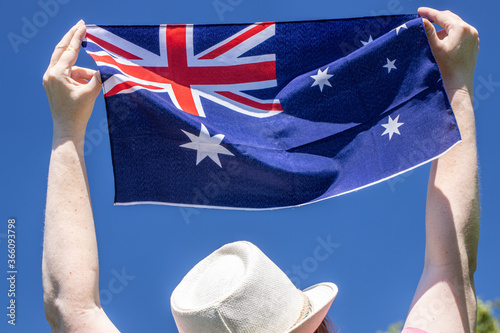 Photography Girl holding the Australian flag during the Australia Day