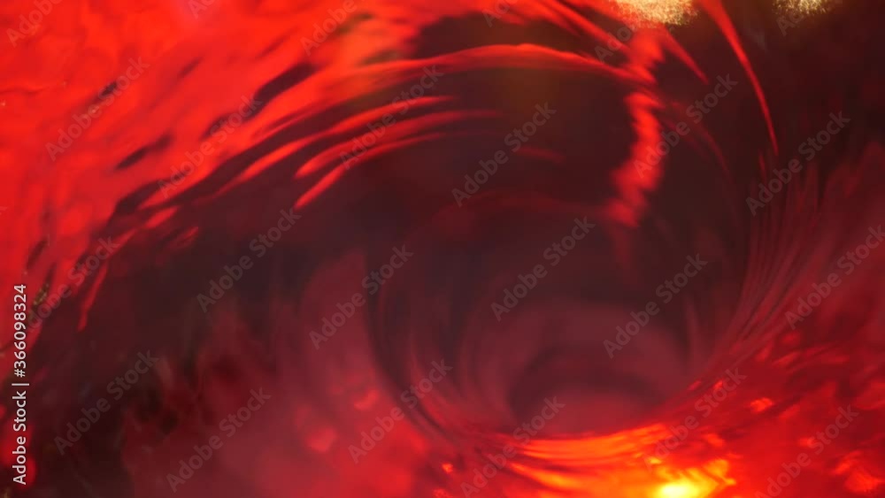 Symbol of hell, inferno and infinity. Red liquid hypnotic aqua swirl turning. Meditative ruby luminous whirlpool. Mesmerising spiral tunnel of crystal fluid. Fiery surreal rhythmic water gradient.