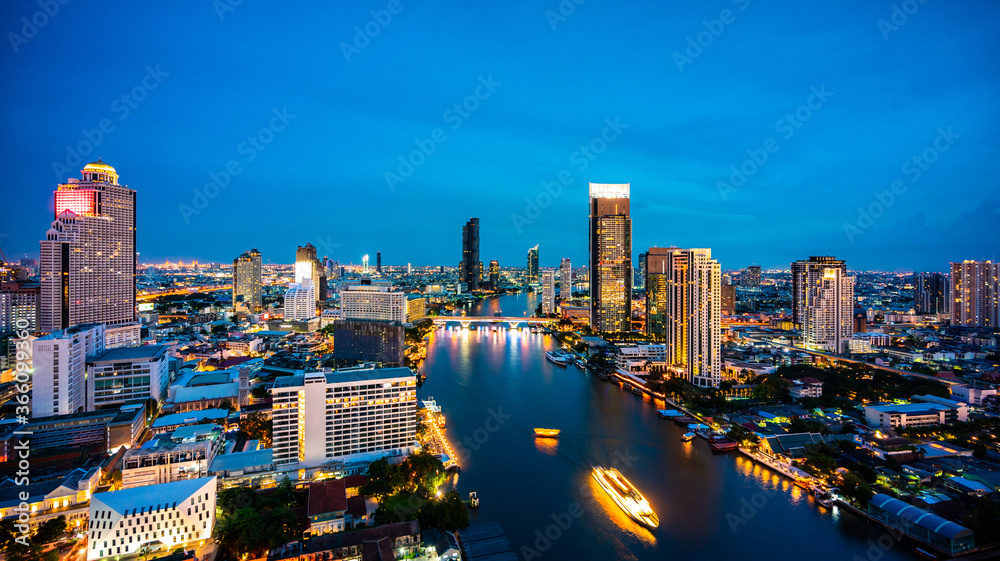 Landscape of city and river in Bangkok, Thailand, cityscape at twilight time in aerial view of Bangkok skyline and skyscraper with light trails street