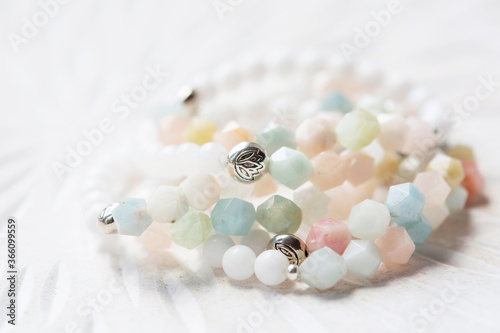 Cubic faceted morganite mineral stone beads bracelet on white background photo