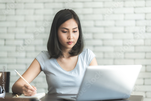 Asian young women using lab...