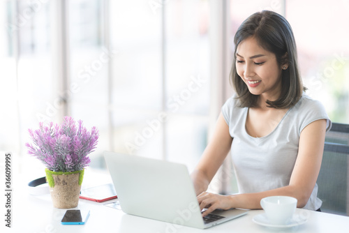Asian young women using lab...