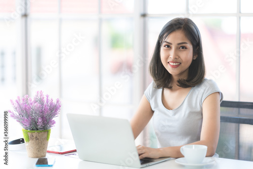 Asian young women using lab...
