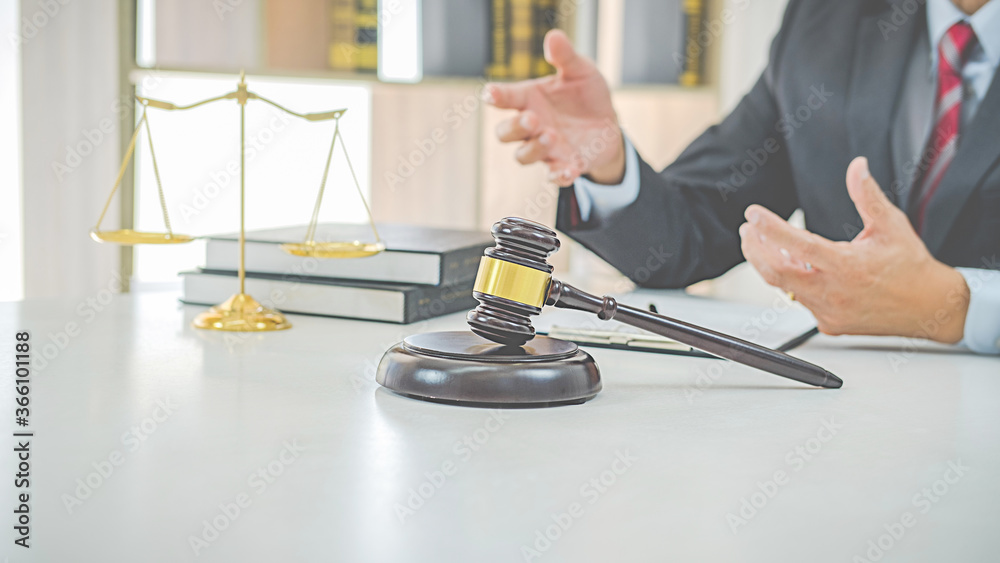 Judge gavel with Justice lawyers having team meeting at law firm background. Concepts of Law and Legal services. Judge gavel with Justice lawyers having team meeting at law firm background. Concepts of Law and Legal services.