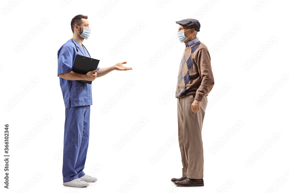 Full length profile shot of a healthcare worker talking to an elderly man with a face mask Full length profile shot of a healthcare worker talking to an elderly man with a face mask