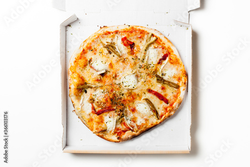 Cheese and pepper pizza in a cardboard box