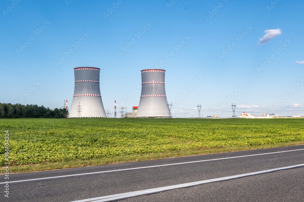 Cooling towers of nuclear power plant against the blue sky Cooling towers of nuclear power plant against the blue sky