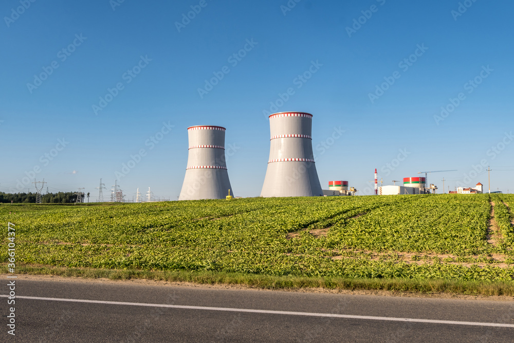 Cooling towers of nuclear power plant against the blue sky Cooling towers of nuclear power plant against the blue sky