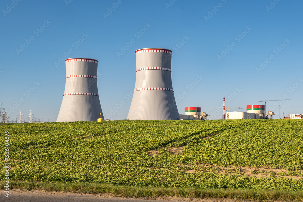 Cooling towers of nuclear power plant against the blue sky Cooling towers of nuclear power plant against the blue sky