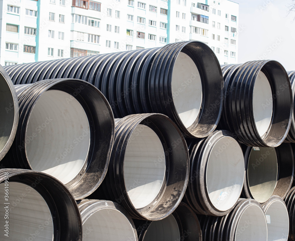 Large diameter plastic pipes for supplying heating and water supply to the house. Modern method of laying durable pipes, chemical resistance, copy space. Industry Large diameter plastic pipes for supplying heating and water supply to the house. Modern method of laying durable pipes, chemical resistance, copy space. Industry