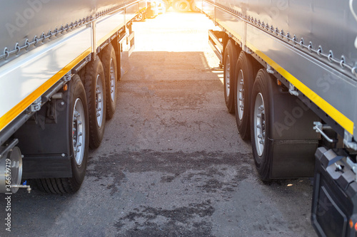 фотографія Two new truck semi-trailers are parked in a truck stop