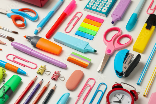 Flat lay with different school supplies on white background photo