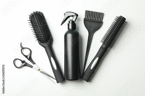 Composition with hairdresser accessories on white background