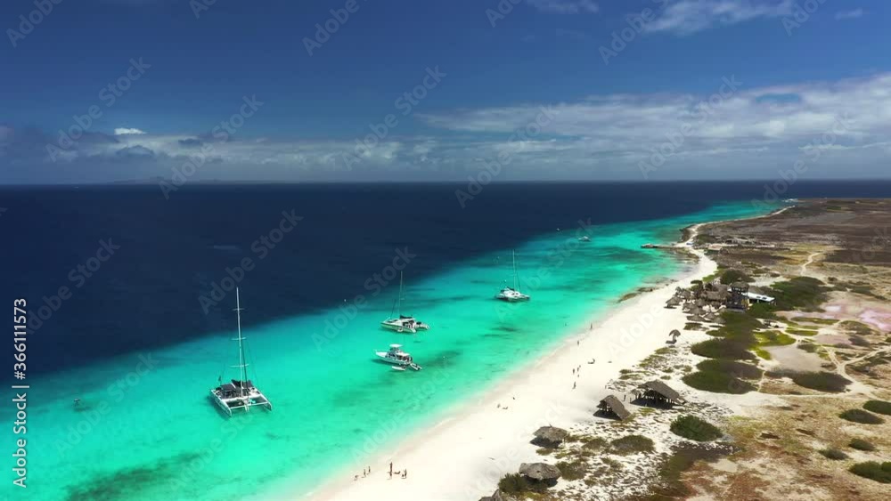Aerial view of coast of Klein Curacao in the Caribbean Sea with turquoise water, cliff, beach and beautiful coral reef Aerial view of coast of Klein Curacao in the Caribbean Sea with turquoise water, cliff, beach and beautiful coral reef