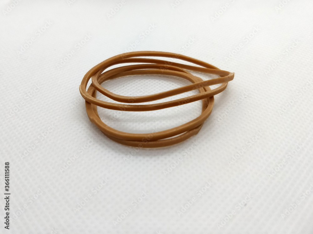 A bunch of rubber bands over a white A bunch of rubber bands over a white