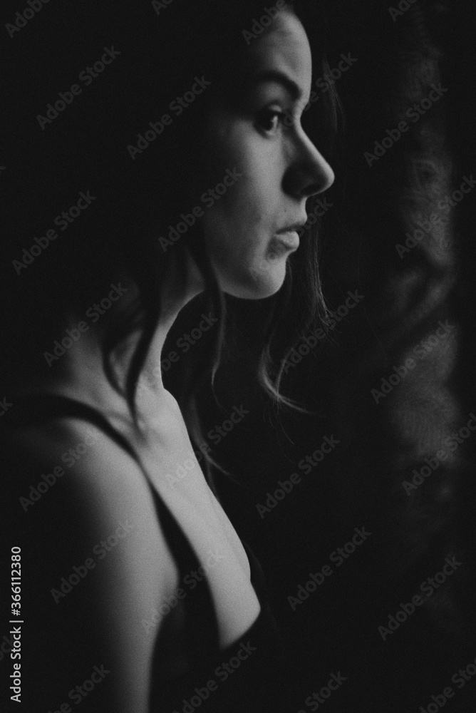 Portrait of a young girl on a dark background
Portrait of a young girl on a dark background