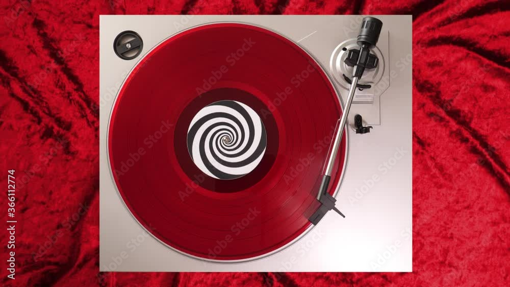 12 inch red vinyl record on a DJ turntable with red velvet background