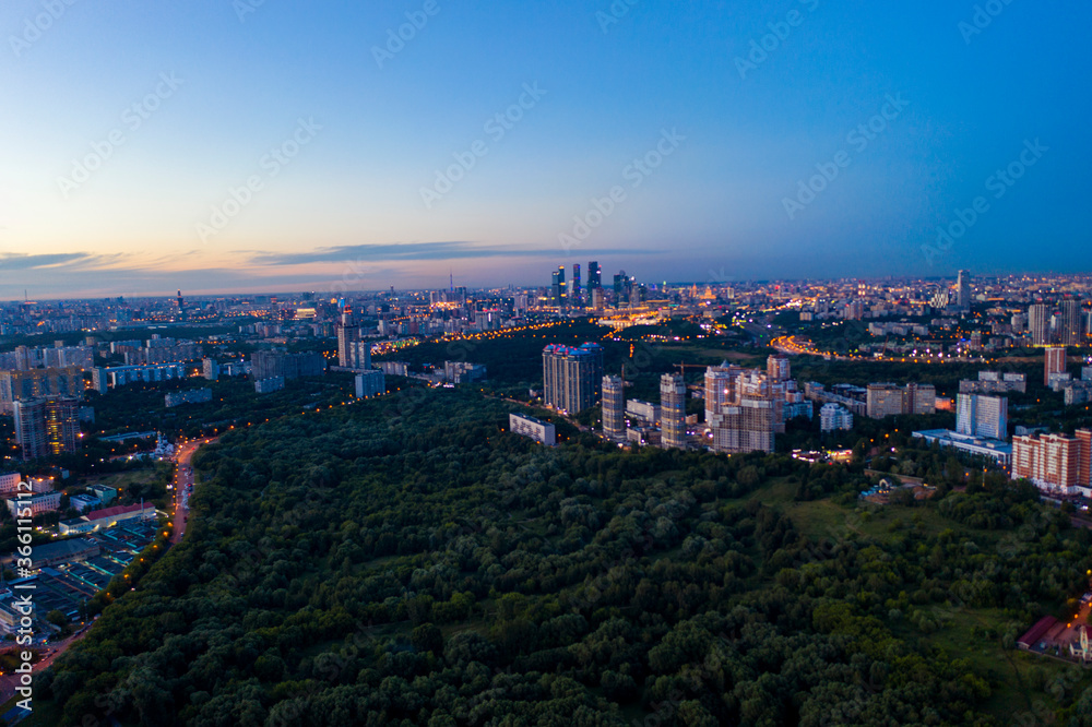 panoramic views of the city infrastructure in the evening filmed from a drone