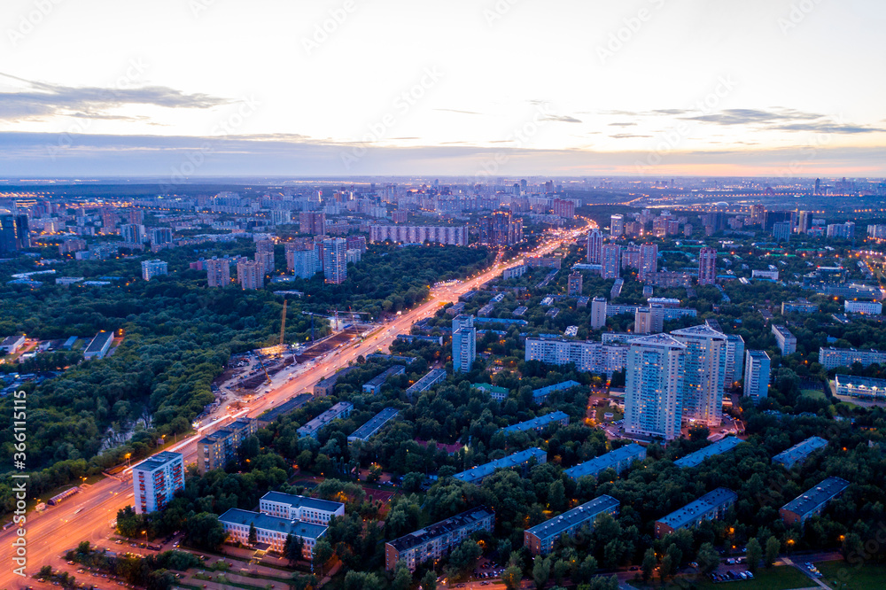 panoramic views of the city infrastructure in the evening filmed from a drone