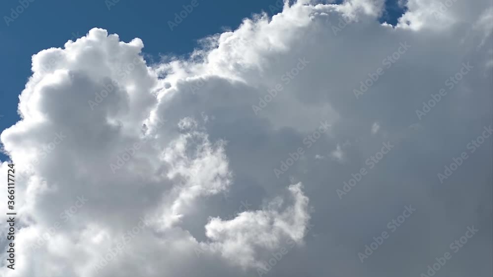 Timelapse of Cumulus cloud formation on a clear summer day close up Timelapse of Cumulus cloud formation on a clear summer day close up