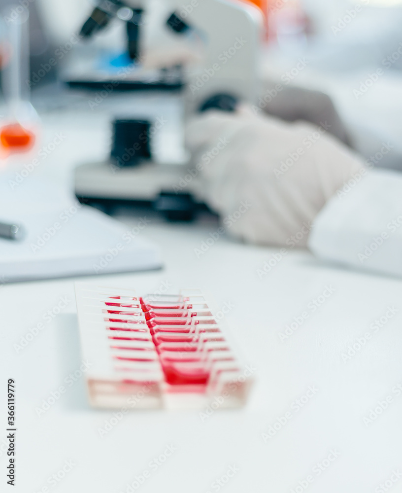 blurry image of a desktop in a medical laboratory. blurry image of a desktop in a medical laboratory.