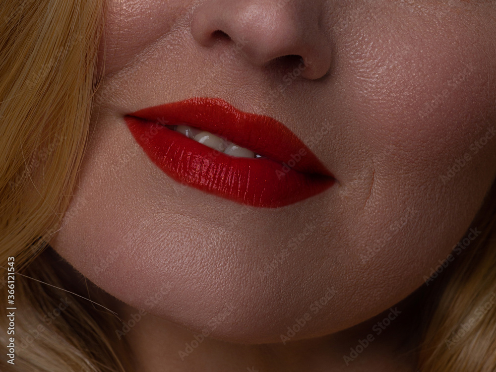 Fototapeta premium Sexual full lips. Natural gloss of lips and woman's skin. The mouth is closed. Increase in lips, cosmetology. red lips. Great summer mood with open eyes. fashion jewelry. pink lip gloss