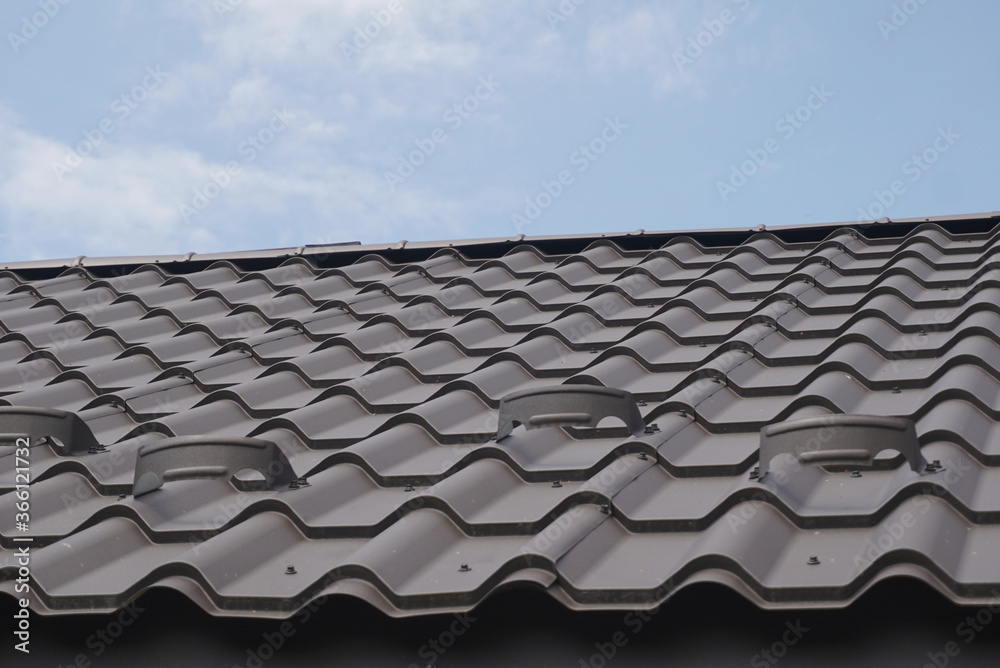 Fototapeta premium Black Metal Tile Roof. Roof Metal Sheets.