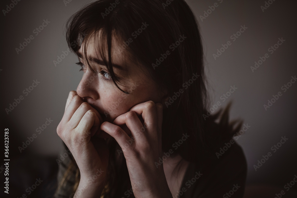 Close-up of worried woman looking away Close-up of worried woman looking away