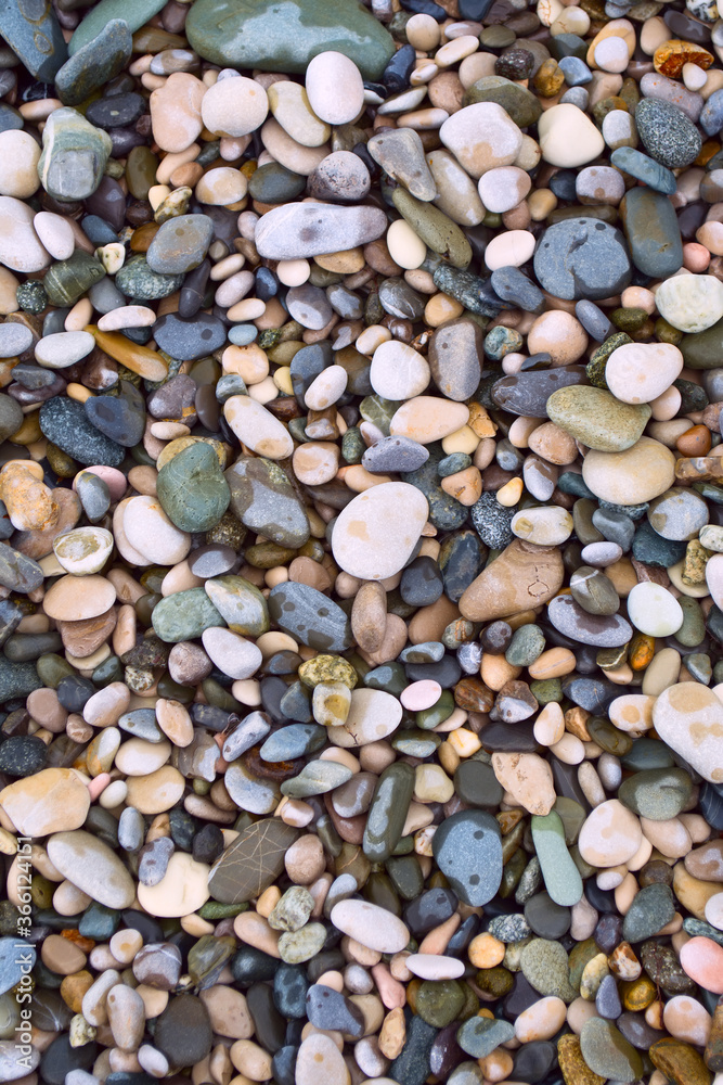 Naklejka premium Sea stone texture. Sea wallpaper with pebbles from the coast.