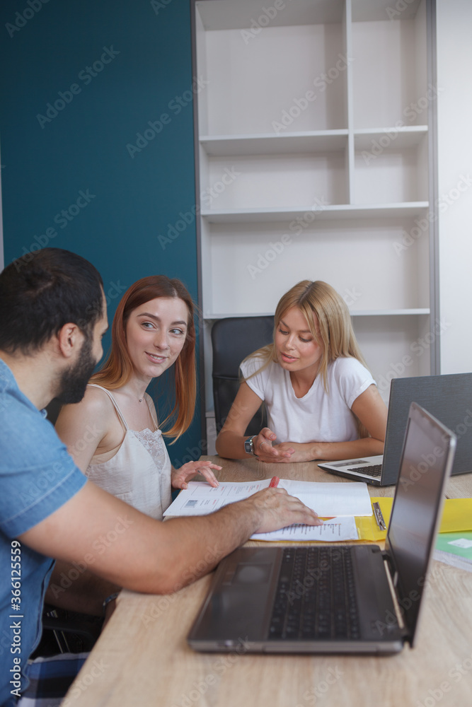 Vertical shot of a business team working together Vertical shot of a business team working together