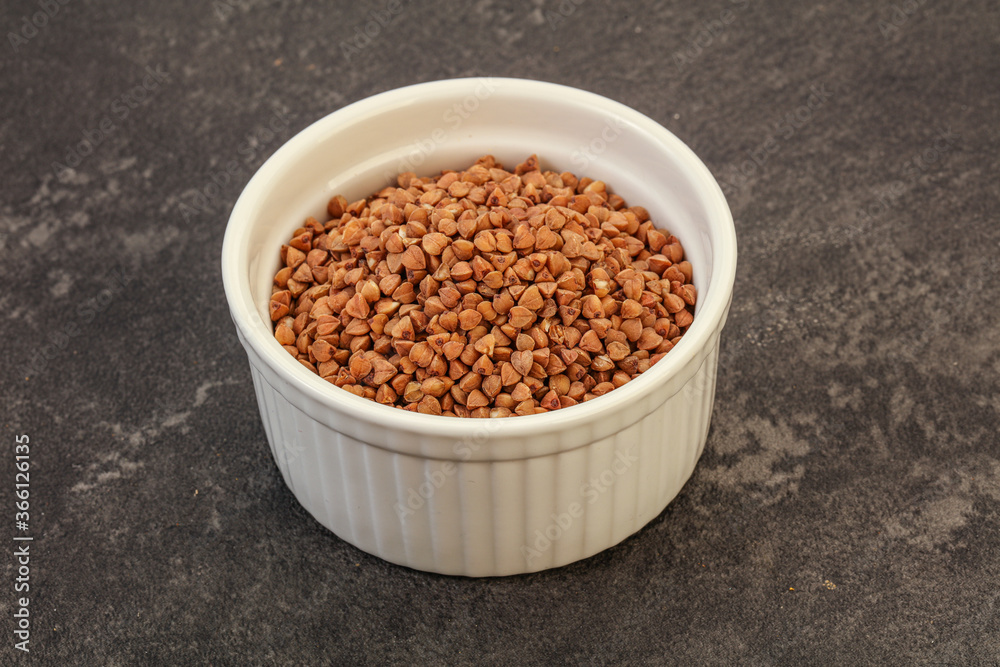Raw buсkwheat cereal in the bowl Raw buсkwheat cereal in the bowl